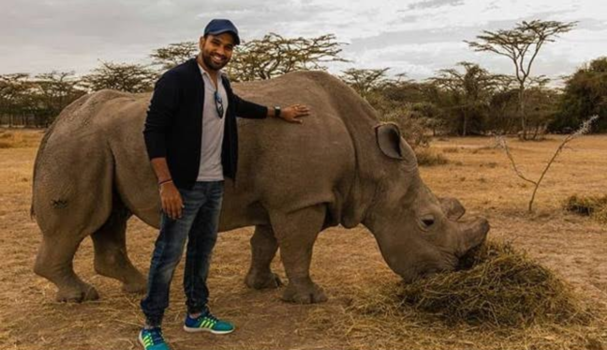 Rohit Sharma with a northern white rhinoceros at Ol Pejeta Conservancy